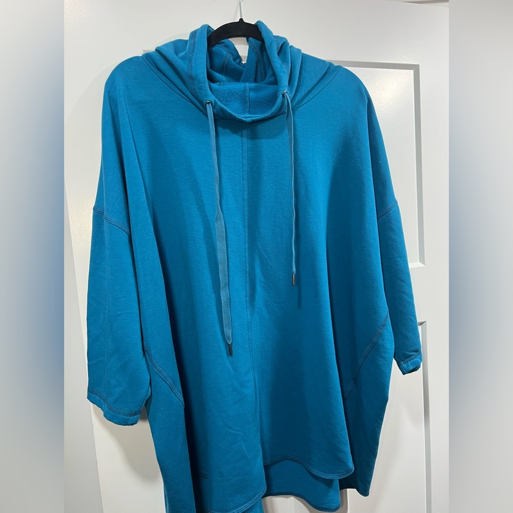 Woman Within Blue Turtleneck shirt